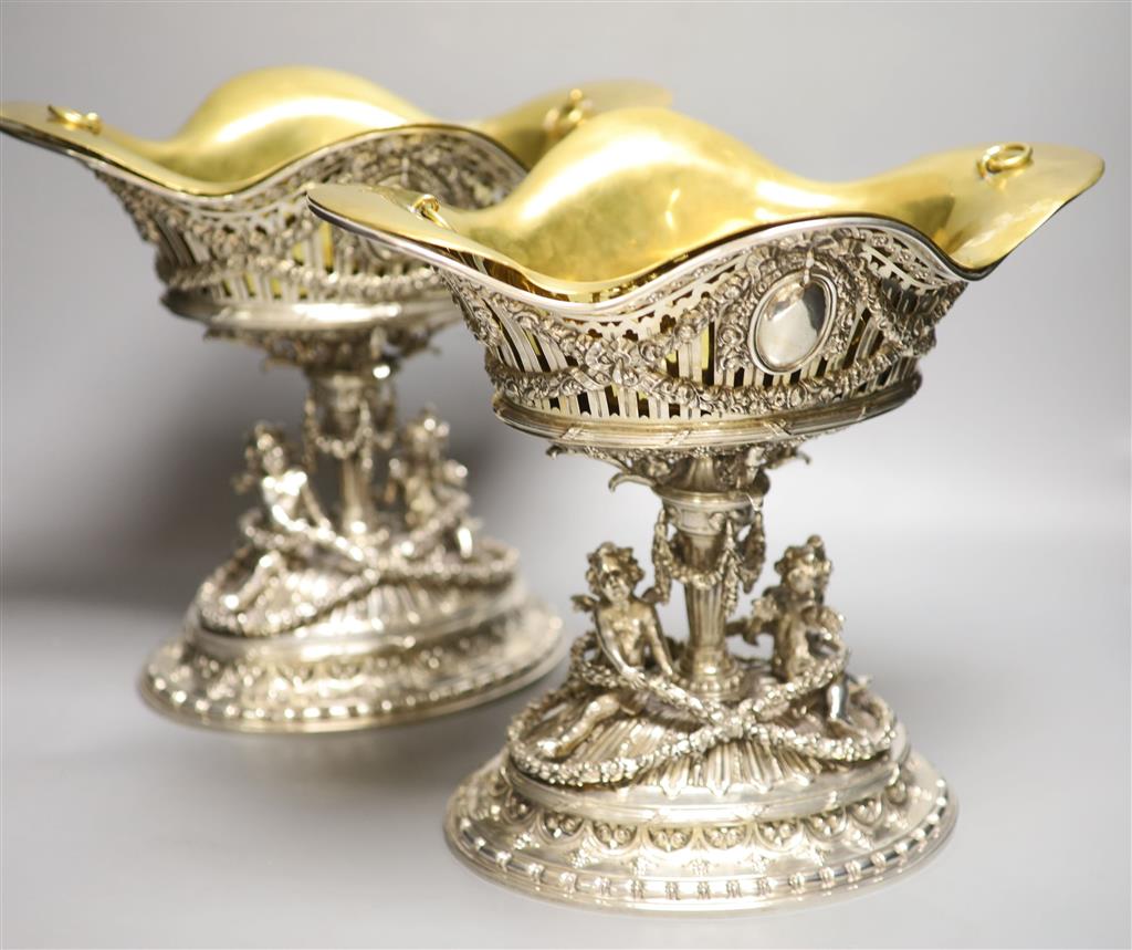 A good ornate pair of late 19th/early 20th century German pierced 800 standard white metal comports by Posen,